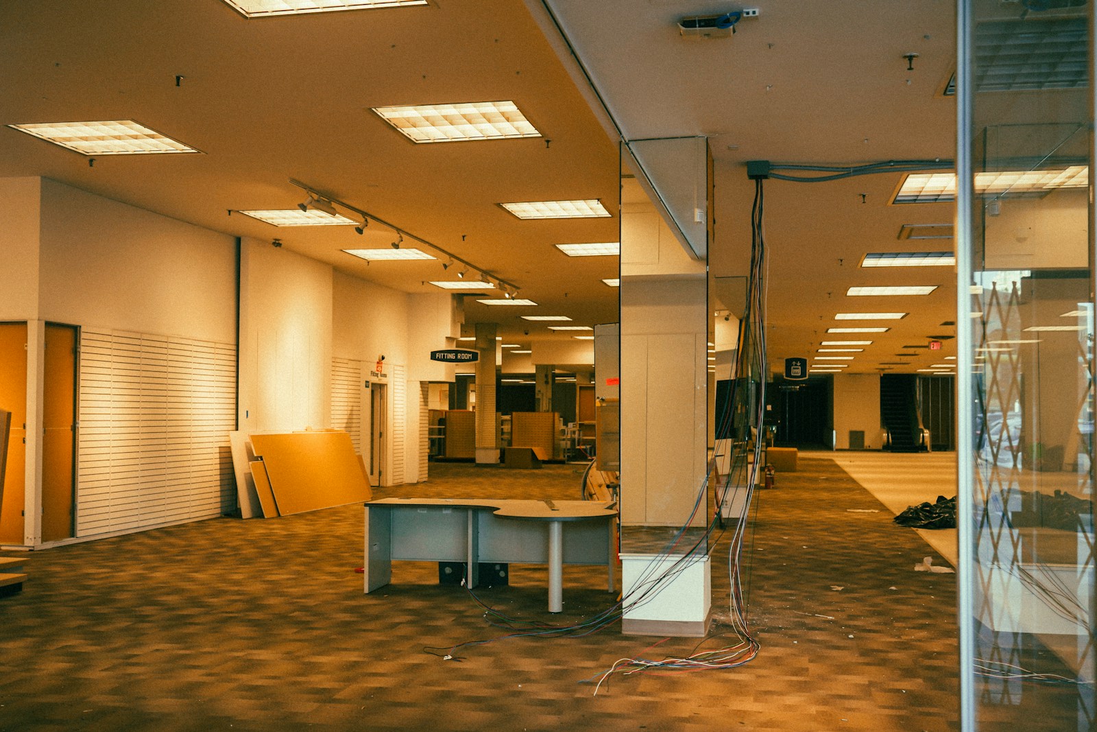 an empty room with a long table in the middle of it